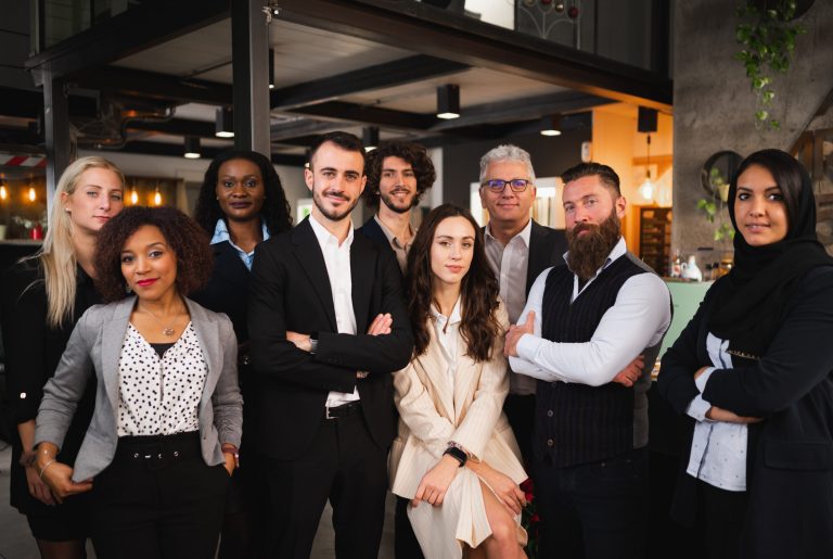 Large group of colleagues posing. Elegant business people with different age and ethnicity